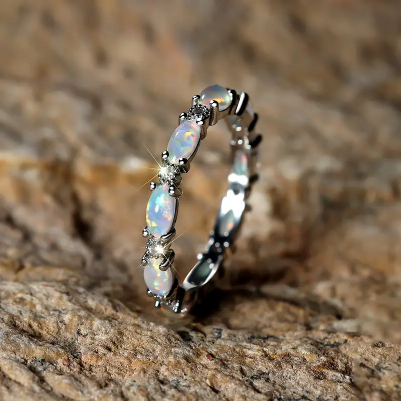 Image of the Eternity Opal Band Ring – a radiant ring with shimmering opals in a continuous band, symbolizing elegance and eternity.

