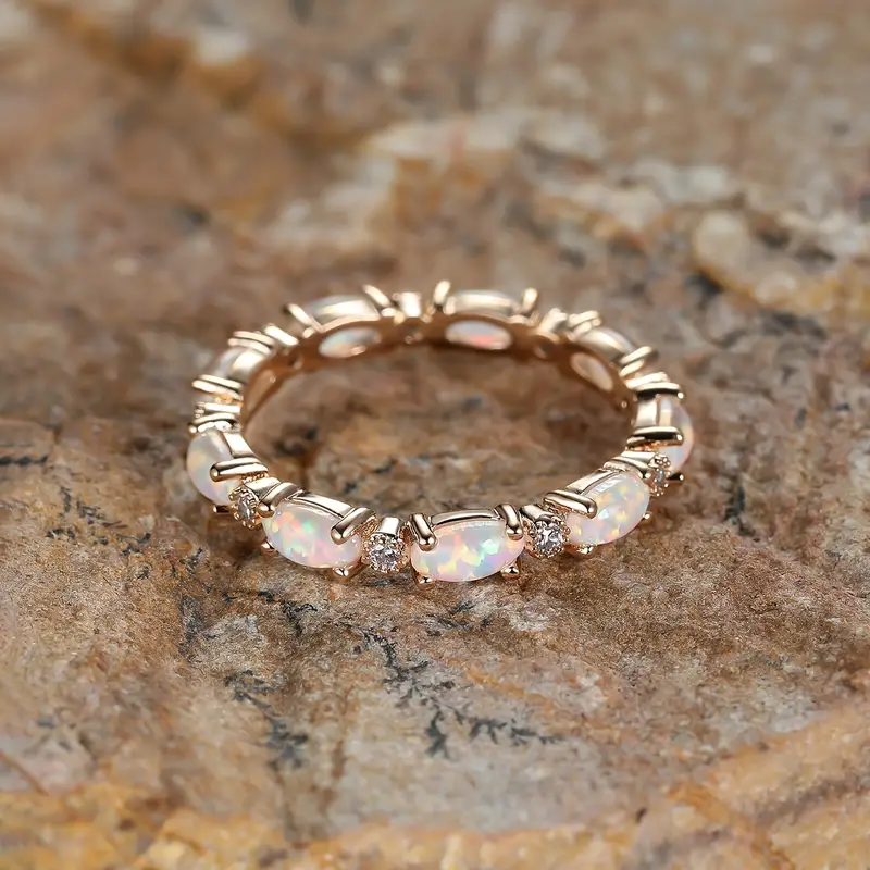 Image of the Eternity Opal Band Ring – a radiant ring with shimmering opals in a continuous band, symbolizing elegance and eternity.

