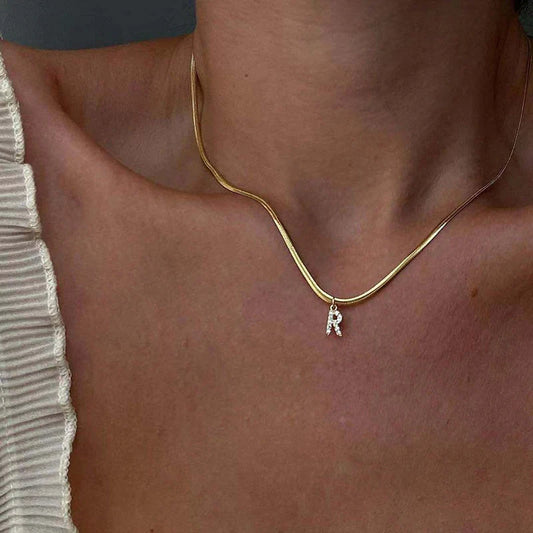 Herringbone Initial Necklace with a stylish chain and personalized initial pendant.

