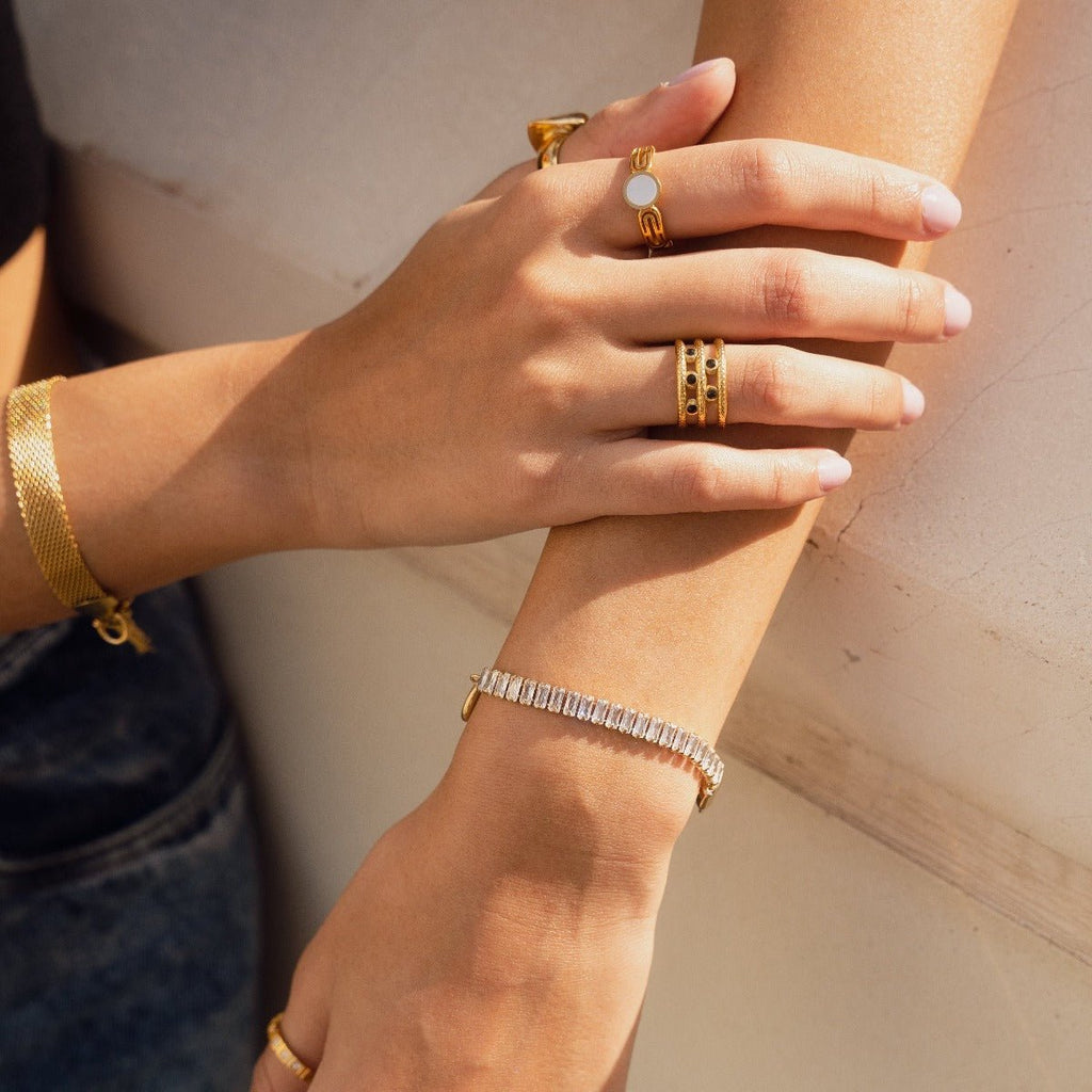 Image of the Opal Oasis Bracelet – a delicate 18K gold stainless steel bracelet featuring luminous opals for a soft, serene, and elegant look.

